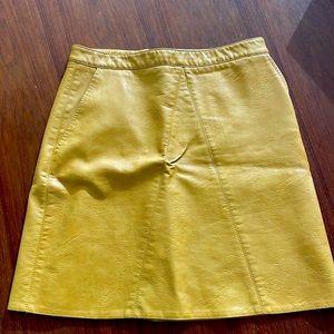 Yellow/gold faux leather mini skirt with side pockets